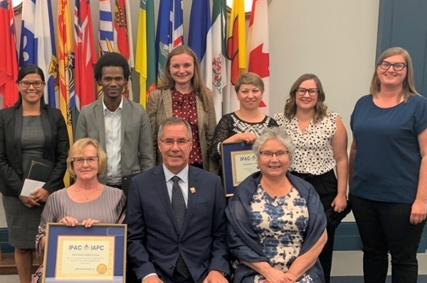 L-R: (top) Jessica Ascencio, Sulaiman Jalloh, Nataliia Karpiak, Iryna Soloduk, Amanda Noubarian, Meaghen Boiteau, (bottom) Betty Ann Pottruff, Honourable Russ Mirasty, Her Honour Donna Mirasty